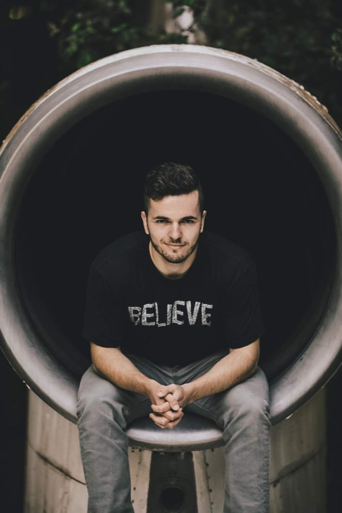 Troy Ericson, wearing a shirt lettered "believe" is the founder of Email List Management. Get certified through the Email List Management Certification Program from Email Paramedic.